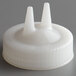 A white plastic Vollrath Twin Tip bottle cap with two pointy tips.