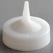 A white plastic Vollrath Traex wide mouth bottle cap with a single tip.