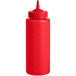 A red plastic Vollrath Traex squeeze bottle with a lid.