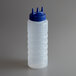 A clear plastic Vollrath Tri Tip squeeze bottle with a blue cap.