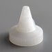 A white plastic cap with a cone.