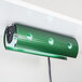 A green light fixture with a green Curtron UV bulb with holes.