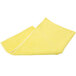A yellow Unger SmartColor microfiber cloth with white edges folded up on a white background.