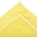 A yellow Unger SmartColor microfiber cloth folded in half.