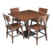 A Lancaster Table & Seating solid wood live edge dining table and 4 chairs with an antique walnut finish.