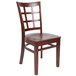 A Lancaster Table & Seating mahogany wood window back chair with a mahogany wood seat on a white background.