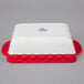 A white and red rectangular Tuxton casserole dish box.