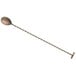 A Barfly antique copper-plated stainless steel bar spoon with a long handle.