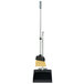 An Unger SmartColor broom and dustpan with a telescopic handle.