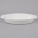 A Tuxton bright white oval china casserole dish with handles.
