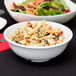 A Diamond White melamine bowl filled with pasta salad and vegetables.