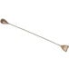 An antique copper-plated stainless steel bar spoon with a long handle.