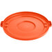 An orange plastic Lavex lid for a round trash can with handles.