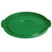 A green plastic lid with a circle handle.