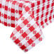 A roll of red and white checkered vinyl table cover with flannel back.
