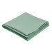 A stack of folded seafoam green Intedge tablecloths.