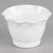 A white Cambro plastic swirl bowl with a wavy edge.