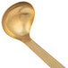 An American Metalcraft hammered gold ladle with a handle.