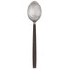 An American Metalcraft stainless steel spoon with a wavy design.