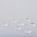 A close up of a white L.A. Baby crib mattress with water drops on the surface.