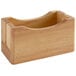 A wooden container with a hole in the middle and a handle.