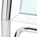 A close-up of a chrome double pedestal poster stand.