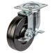 A black plate caster with a silver metal wheel and brake.