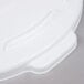 A white Rubbermaid round plastic lid with a handle.