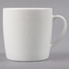 A Tuxton pearl white china mug with a handle.