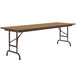 A Correll rectangular folding table with a wooden top and metal frame.
