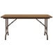 A brown rectangular Correll folding table with black legs.