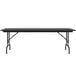 A black rectangular Correll folding table with a black metal frame and adjustable legs.