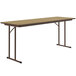 A brown rectangular Correll seminar table with metal legs.