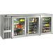 A Perlick stainless steel back bar refrigerator with glass doors and shelves filled with drinks and beverages.