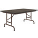 A Correll rectangular walnut melamine folding table with a brown metal frame.