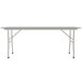 A long rectangular white Correll folding table with a gray metal frame.