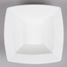 A Bone White square porcelain bowl on a gray surface.