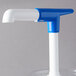 A clear plastic Cambro water pump with a white and blue lid and faucet.