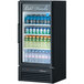 A Turbo Air black refrigerated merchandiser full of bottled water.