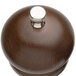A Chef Specialties walnut salt mill with silver accents.