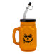 A Jack-O'-Lantern plastic mug with a straw and lid.
