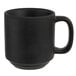 A black Tuxton China mug with a handle.