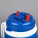 A blue and white plastic Pepsi Tanker with spout and straw.