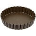 A brown Gobel fluted tart pan with a removable bottom.