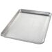 A Chicago Metallic aluminum perforated sheet pan with a metal grid.