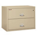 A tan FireKing steel insulated two-drawer lateral file cabinet with a parchment finish.