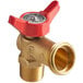 A brass faucet drain with red handle.