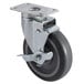 A black swivel caster with a metal wheel.