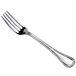 An Oneida Titian stainless steel European table fork with a silver handle.