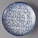 A Schonwald dark blue and white porcelain saucer with a design on it.
